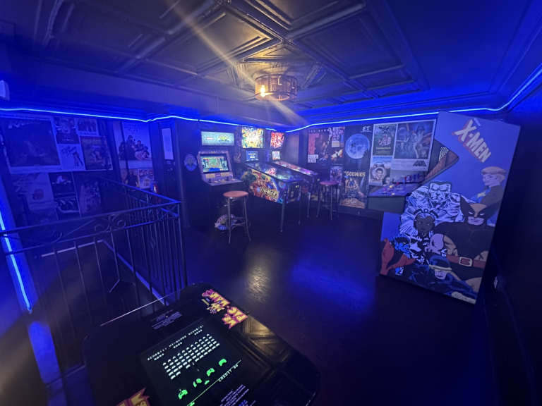 The Back Room at Long Story Short in Lawrenceville, Pittsburgh: pool table, red lounge chairs and framed photos