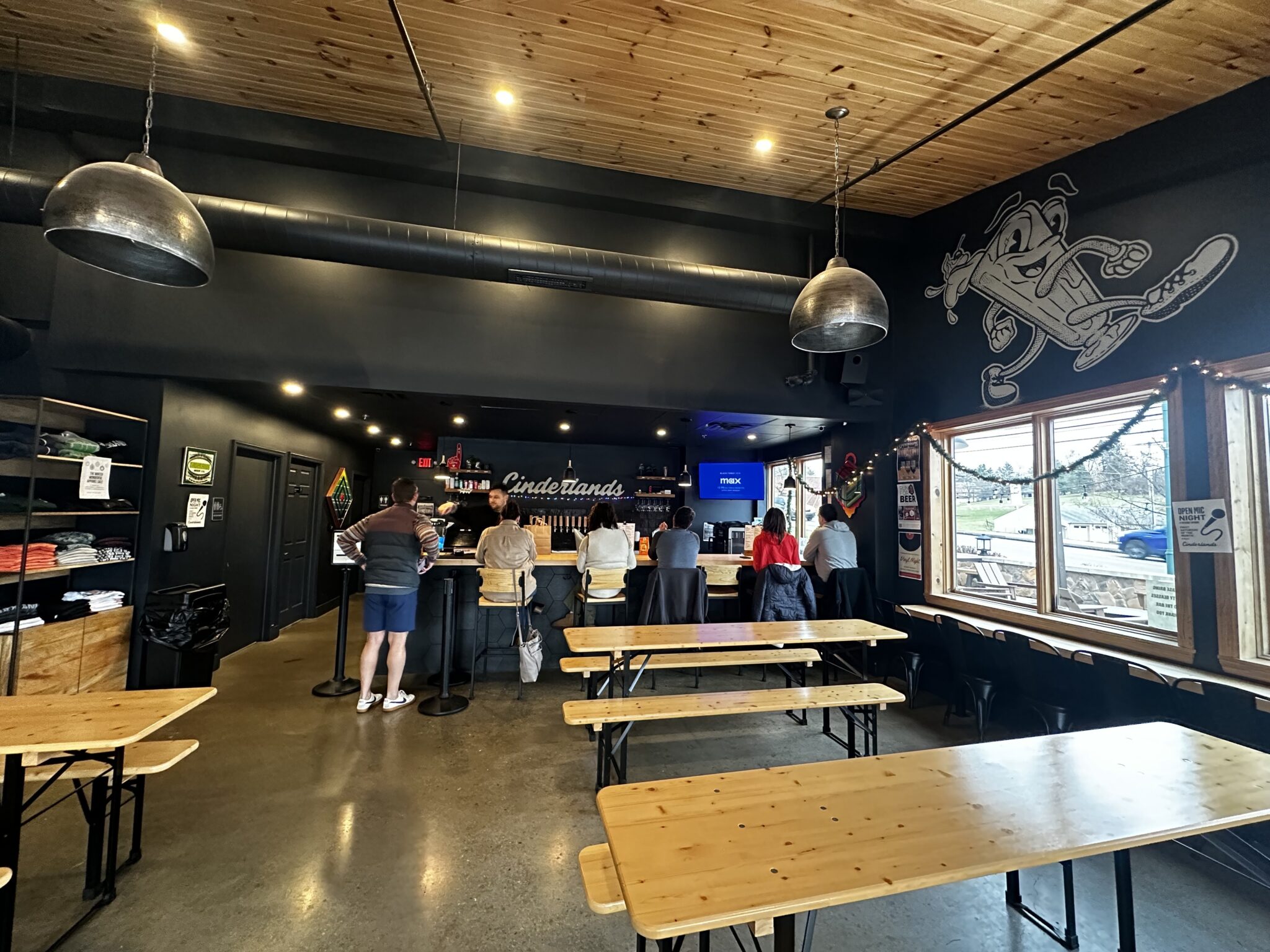 The bar and long tables inside the Wexford Taproom